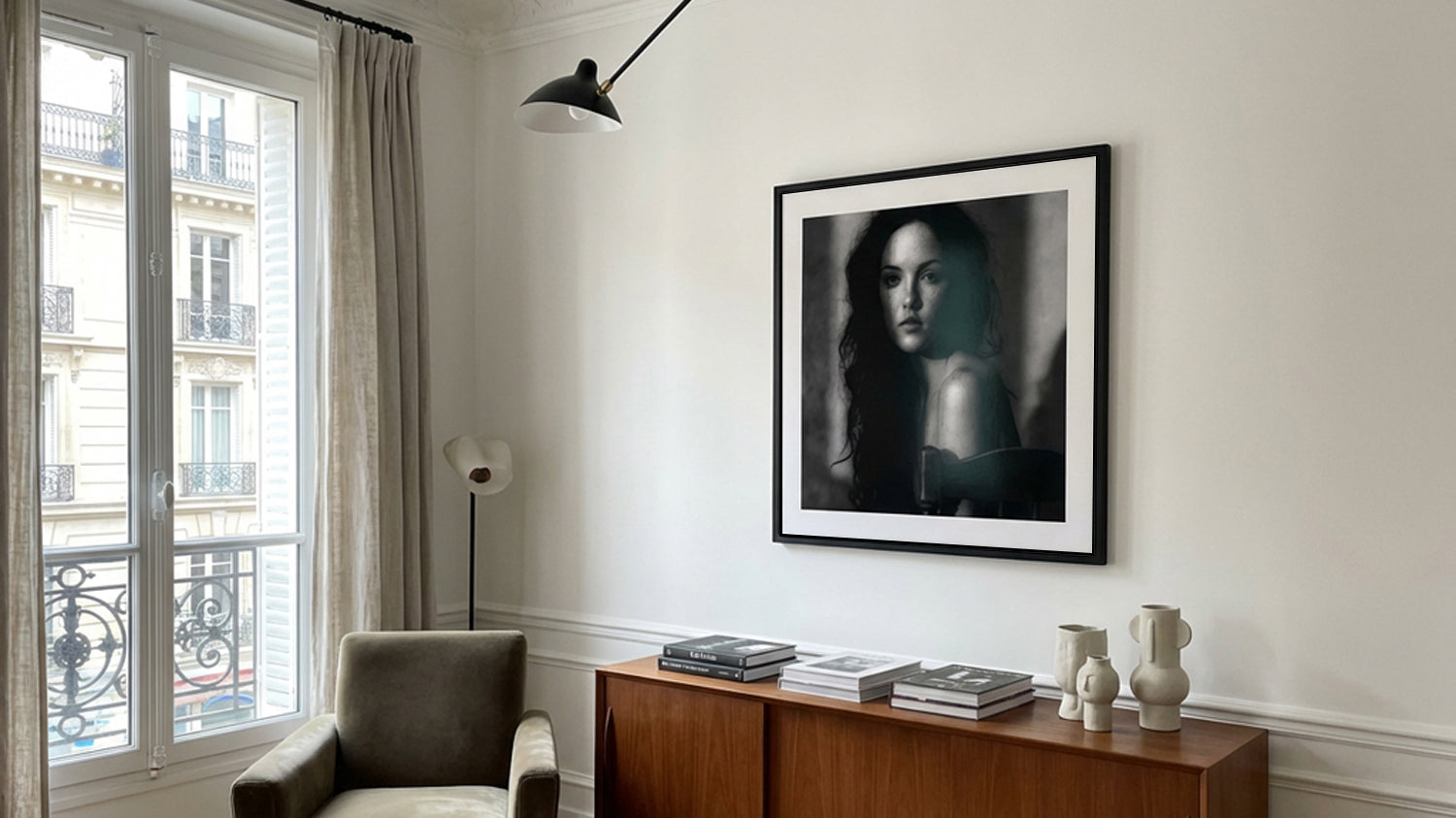 Framed black and white portrait in an elegant Paris apartment interior