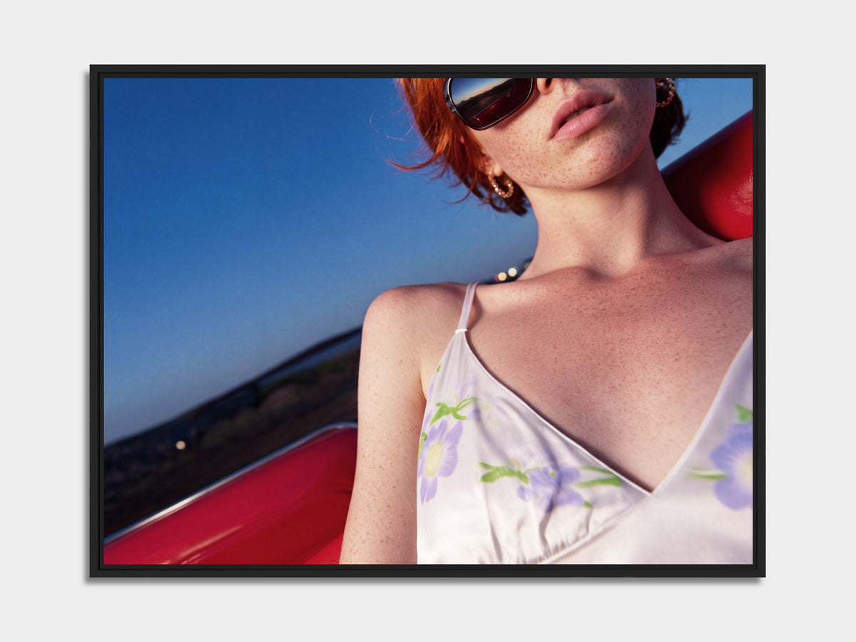 Electric Summer 13 – redhead in sunglasses in a red convertible fine art print, black matt floater frame | Beau Edition