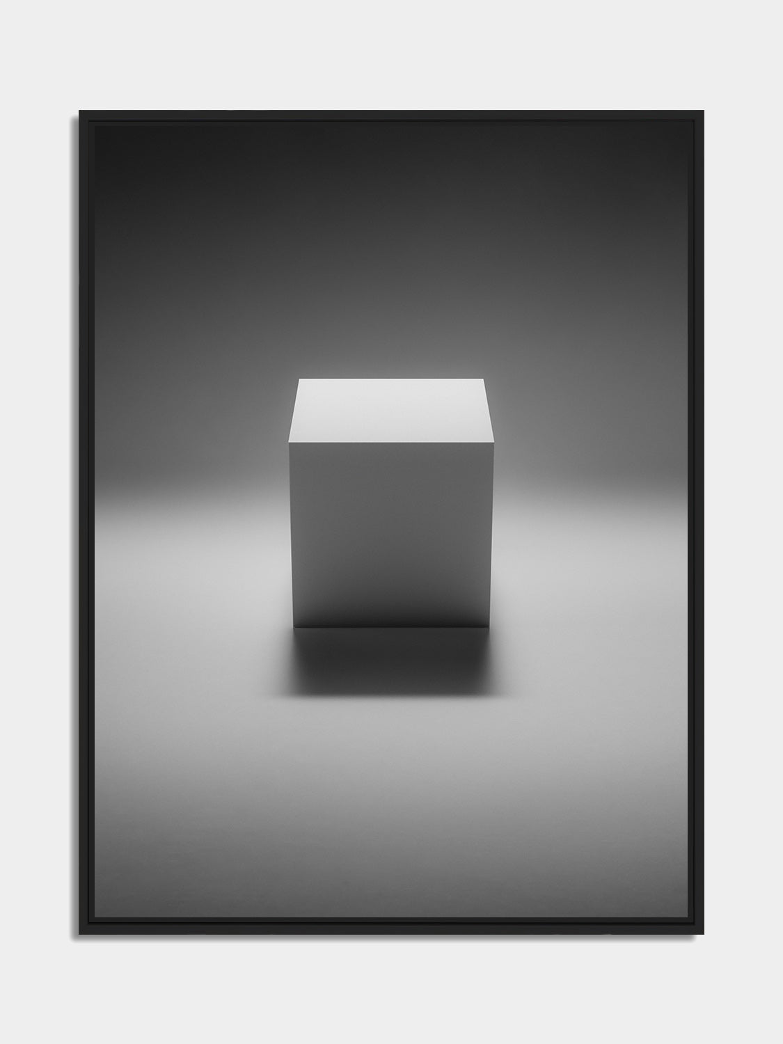 Framed cube print, black matt floater frame, on an office wall — Beau Edition
