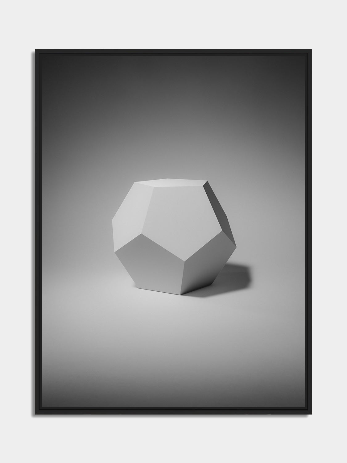 Framed dodecahedron print, black matt floater frame, on an office wall — Beau Edition