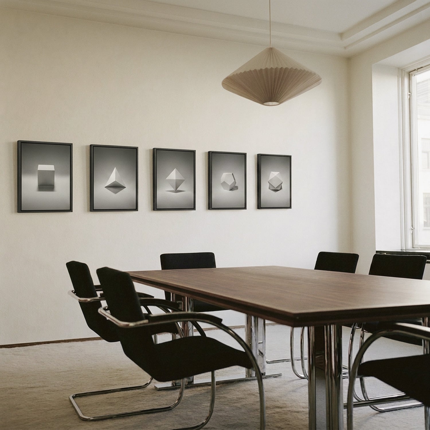 Framed Platonic solid prints in a meeting room — Beau Edition