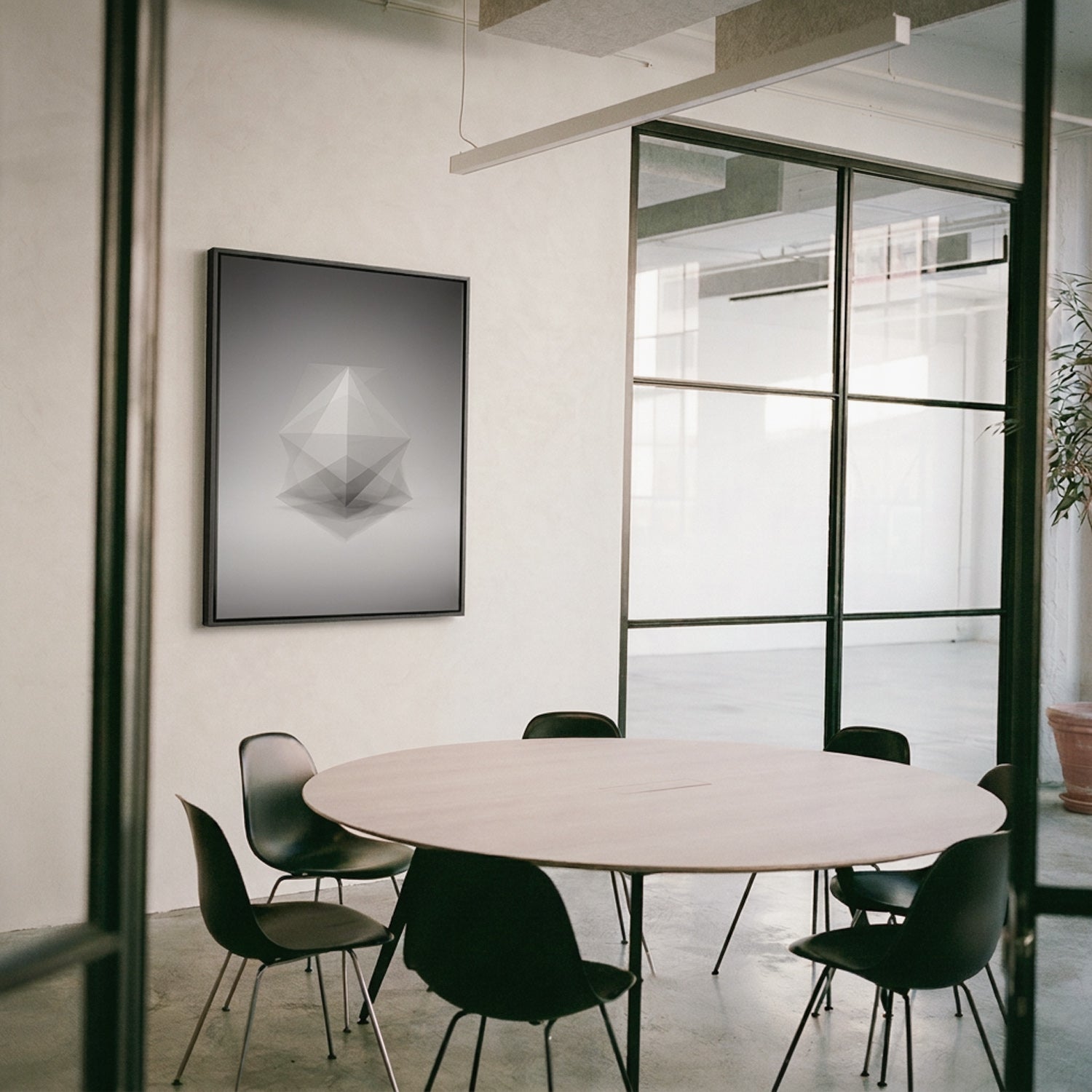Framed Platonic solid prints in a meeting room — Beau Edition